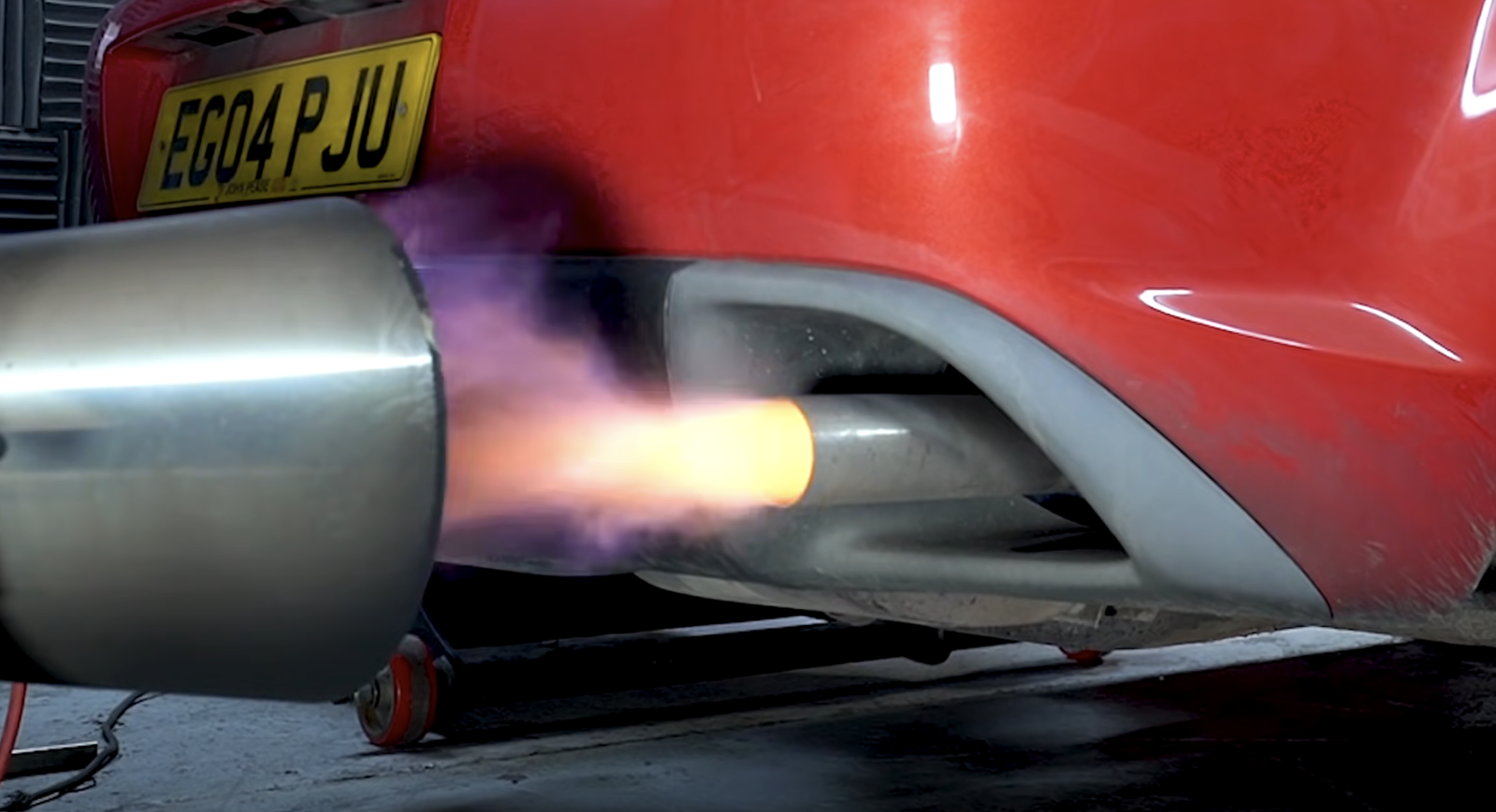A Mazda RX-8 exhaust spitting flames